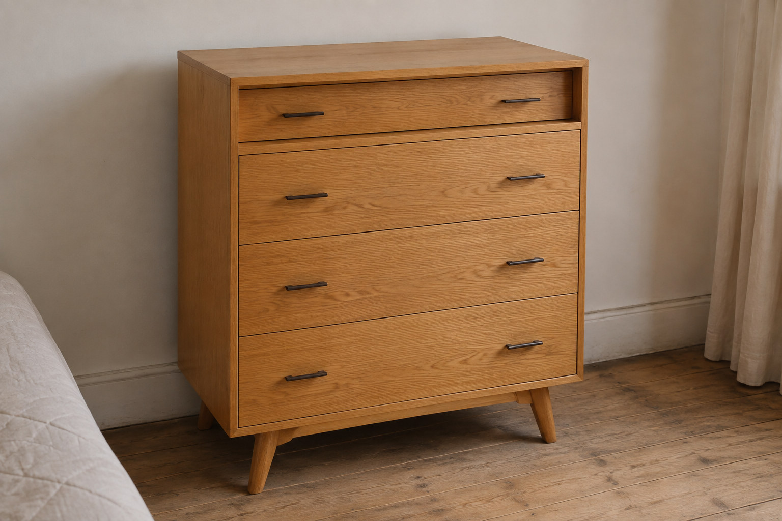 Reconstruction: A light-oak four-drawer bedroom chest whose upper drawer steps back behind the fronts below.