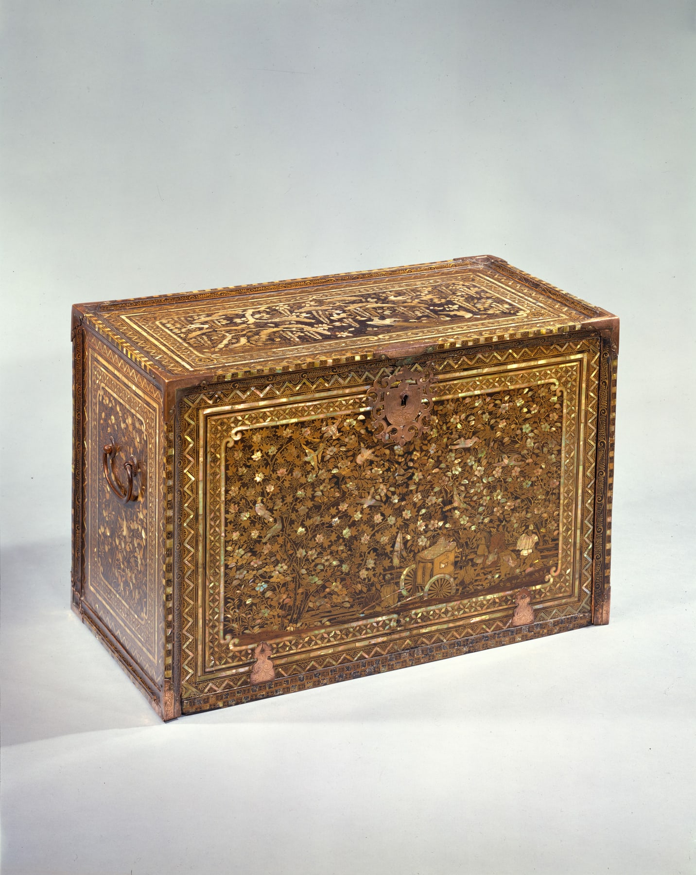The Japanese cabinet closed, showing the decorated front panel before it becomes a horizontal writing surface.