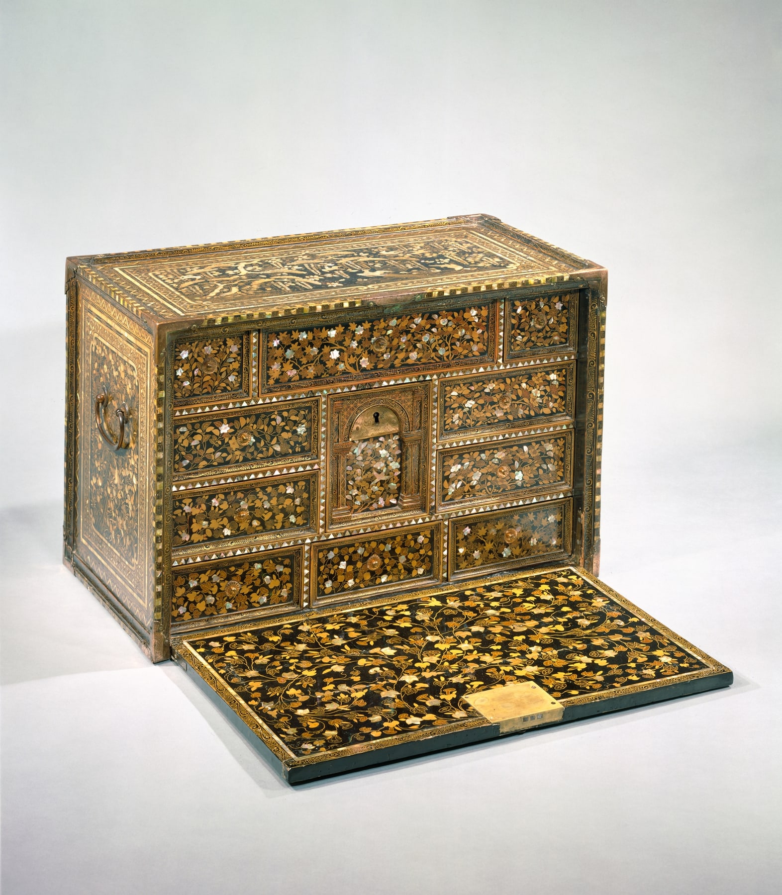 Japanese export cabinet open, with its fall front lowered beneath drawers and a central arched compartment.