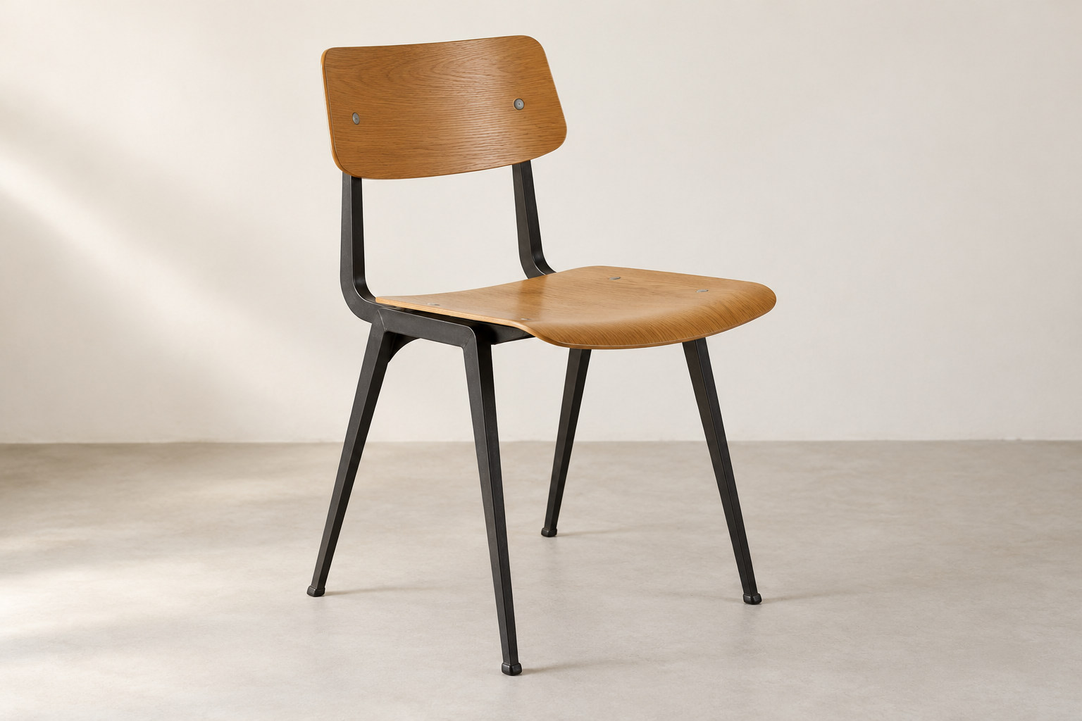Editorial reconstruction of a wooden seat and separate back carried by a dark frame with angular folded-looking metal legs.