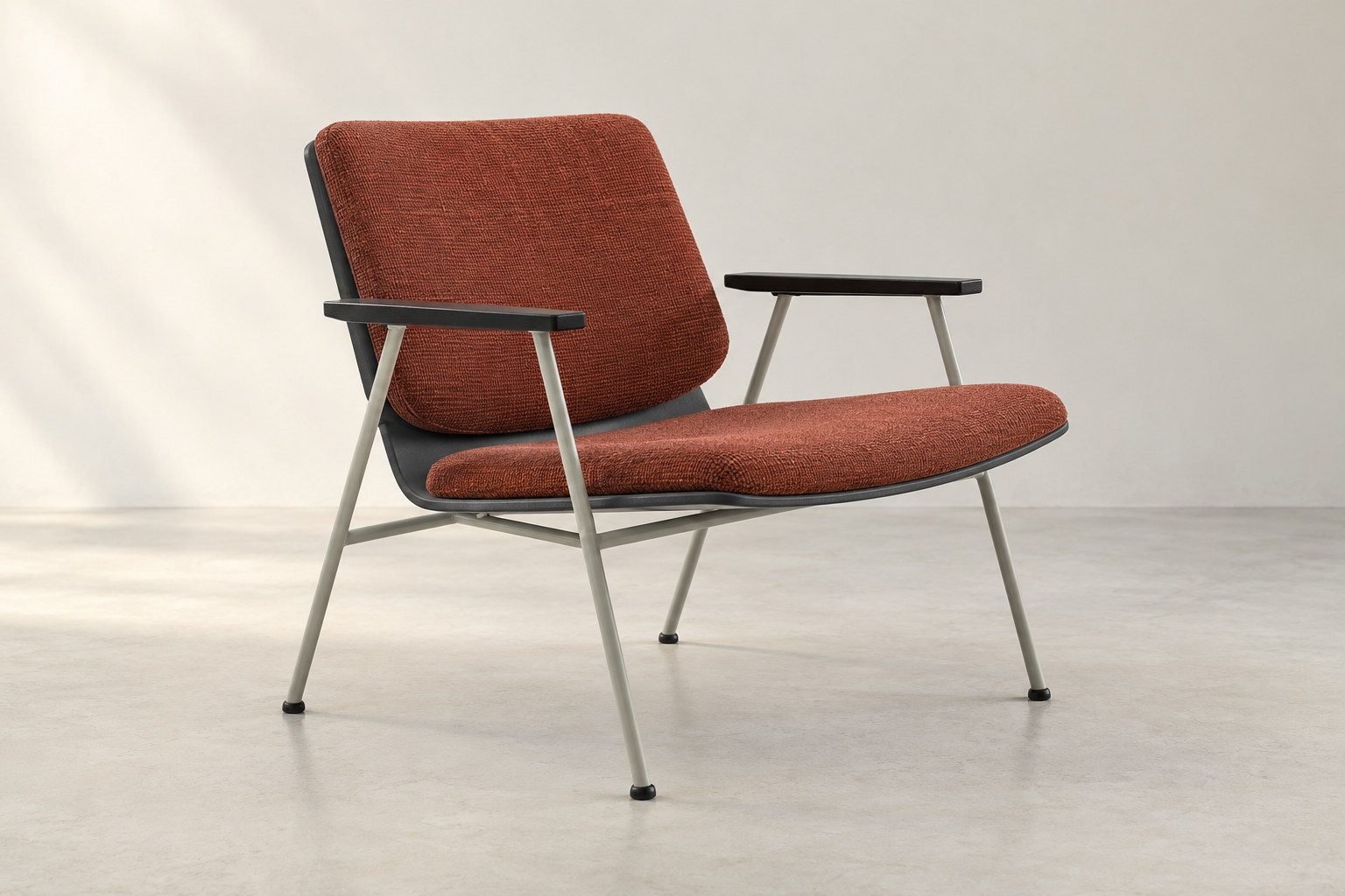 Editorial reconstruction of an orange upholstered lounge seat raised above a slender open light-grey metal support.