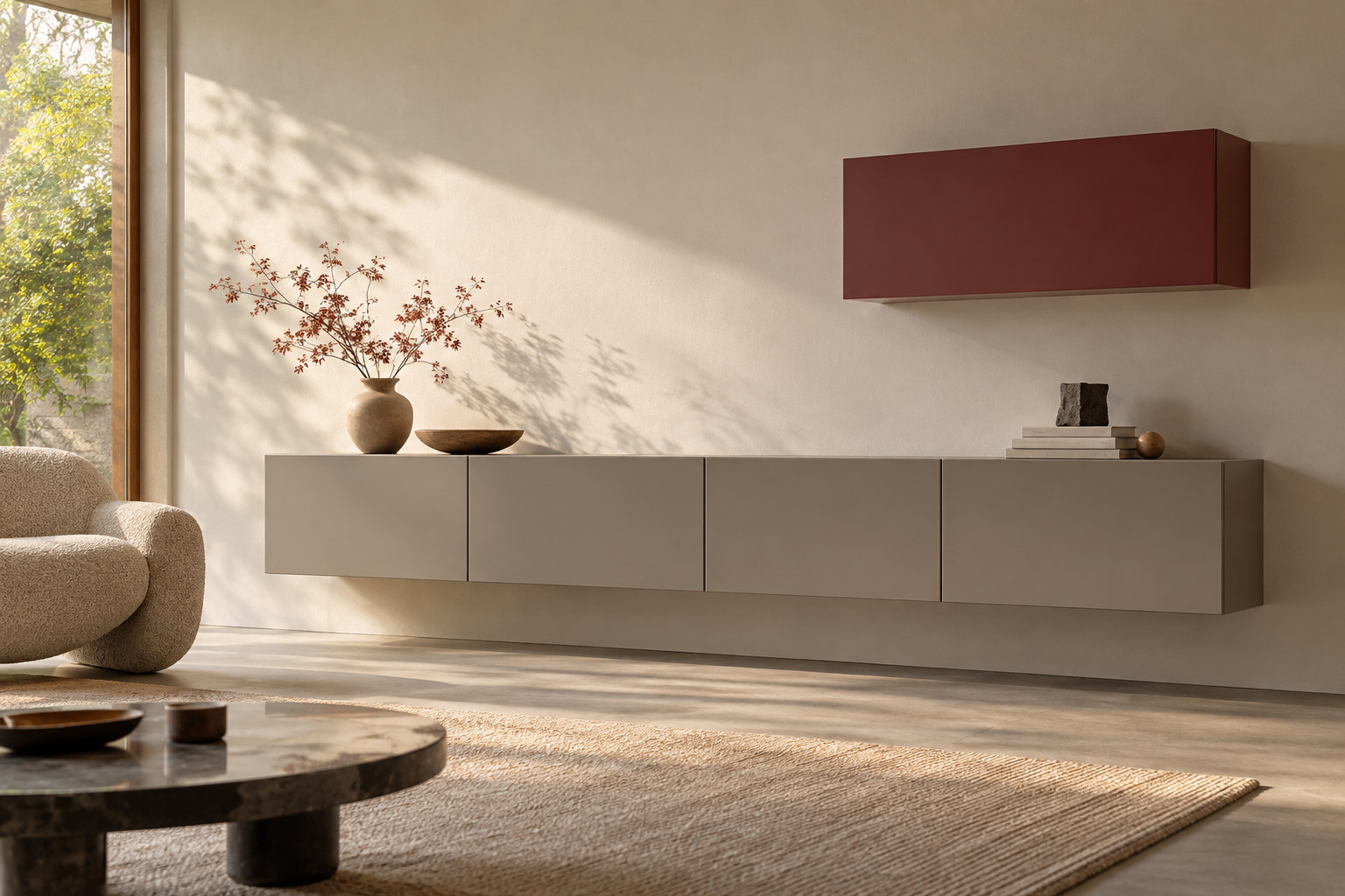 Handleless wall-mounted cabinet volumes in muted grey and burgundy, separated by open wall space in an imagined interior.