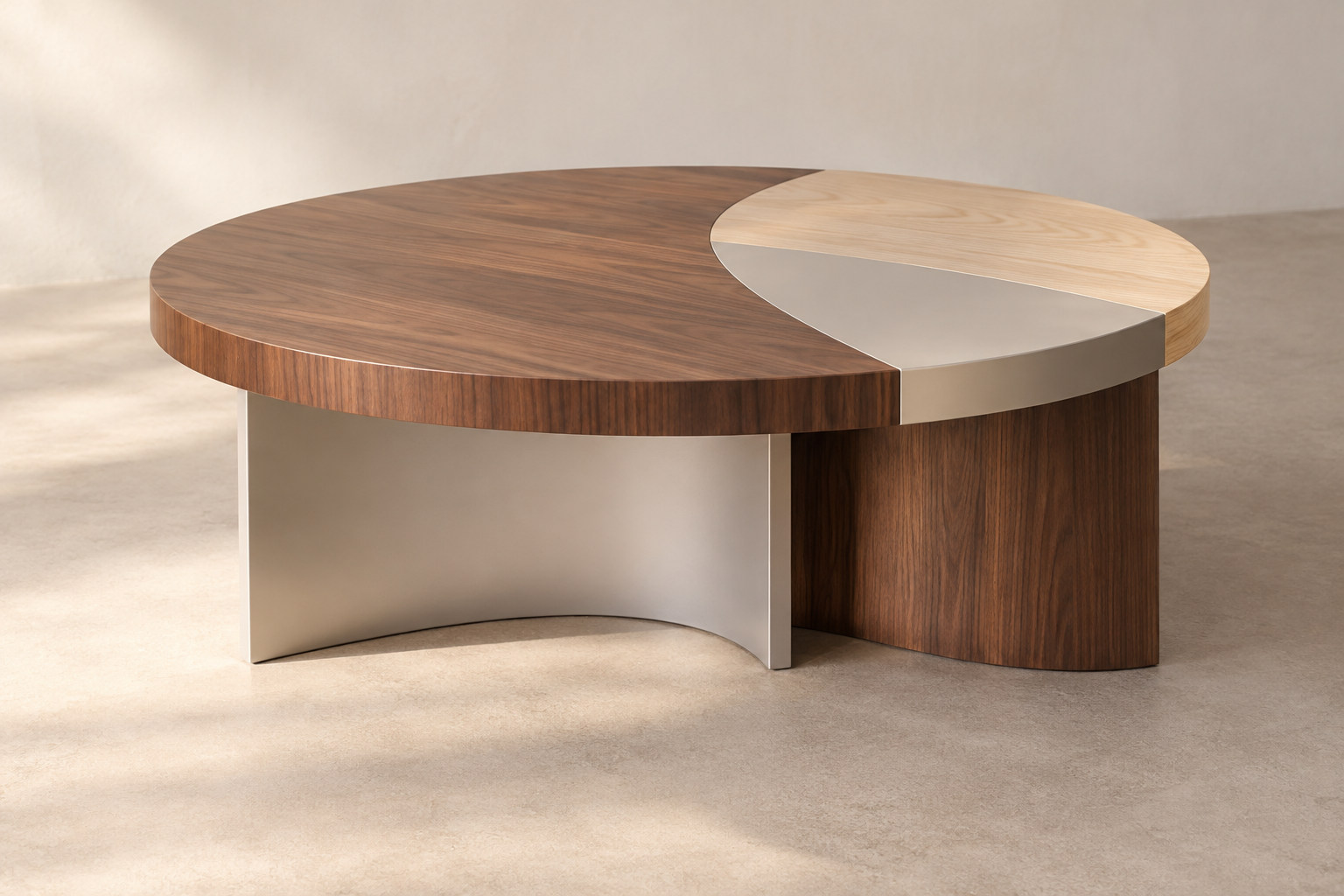 A low circular table combines dark and pale wood-like areas with silver-coloured curved planes.