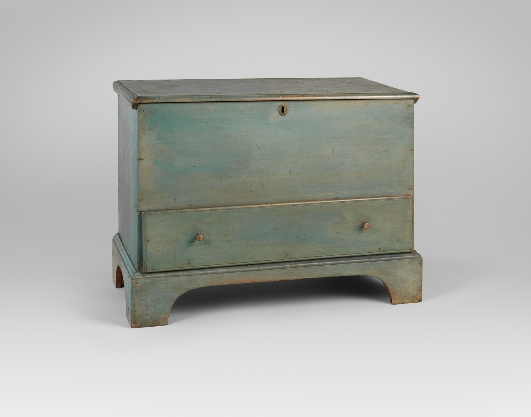 Blue-painted Shaker blanket chest, with a broad lift-top body and a deep lower drawer.