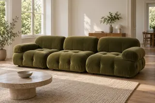 An olive-green tufted modular sofa forms a straight row of three seats with backs and two outer arms.