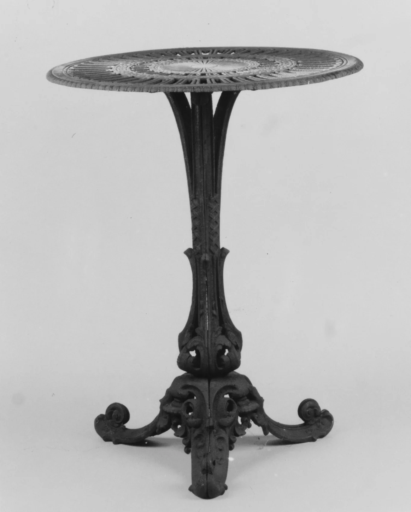 A nineteenth-century cast-iron garden table shown as a complete object against a plain background.